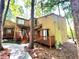 View of the home's exterior, showcasing the front entrance and wood siding at 5806 Par Four Ct, Lithonia, GA 30038