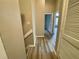 Hallway with wood floors leading to a brightly lit room with a view at 5806 Par Four Ct, Lithonia, GA 30038