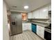 Modern kitchen featuring stainless steel appliances, and white cabinets at 5806 Par Four Ct, Lithonia, GA 30038