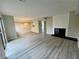 Spacious living room with fireplace and wood floors for a cozy aesthetic at 5806 Par Four Ct, Lithonia, GA 30038