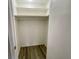 Walk-in closet featuring overhead shelves and ample storage space at 5806 Par Four Ct, Lithonia, GA 30038