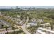 Aerial view of the neighborhood showcasing modern townhomes surrounded by mature trees and the distant city skyline at 904 Lenox Ne Blvd, Atlanta, GA 30324