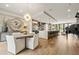 Open concept dining area with modern decor and an open flow to a kitchen with bar seating at 904 Lenox Ne Blvd, Atlanta, GA 30324