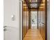A wooden elevator with warm lighting and paneled walls at 904 Lenox Ne Blvd, Atlanta, GA 30324