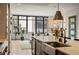 Bright, open kitchen featuring a stainless steel farmhouse sink, quartz countertops, and modern appliances at 904 Lenox Ne Blvd, Atlanta, GA 30324