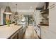 Modern kitchen featuring an island with bar seating, stainless steel appliances, and open floor plan at 904 Lenox Ne Blvd, Atlanta, GA 30324
