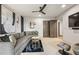 Living room with a large sectional sofa, ceiling fan, and modern art at 904 Lenox Ne Blvd, Atlanta, GA 30324