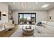 Bright living room features a wet bar, modern lighting and sliding doors to the covered terrace at 904 Lenox Ne Blvd, Atlanta, GA 30324