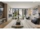 Comfortable living room with a modern fireplace, a decorative wall, and stylish decor at 904 Lenox Ne Blvd, Atlanta, GA 30324