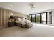Bright main bedroom boasts a large window, stylish decor, a decorative wall, and a cozy seating area at 904 Lenox Ne Blvd, Atlanta, GA 30324
