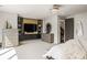 Stylish main bedroom showcases a custom media center, elegant decor, and a doorway leading to additional rooms at 904 Lenox Ne Blvd, Atlanta, GA 30324