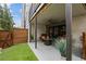 Covered patio with seating, artificial turf, and a wooden fence at 904 Lenox Ne Blvd, Atlanta, GA 30324