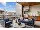 Outdoor kitchen with a stainless-steel grill and overhead vent, on a relaxing covered patio at 904 Lenox Ne Blvd, Atlanta, GA 30324
