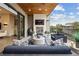 Relaxing covered patio with a fireplace and comfortable seating area for outdoor enjoyment at 904 Lenox Ne Blvd, Atlanta, GA 30324