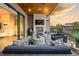 Relaxing covered patio with a fireplace and comfortable seating area for outdoor enjoyment at 904 Lenox Ne Blvd, Atlanta, GA 30324