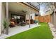 Outdoor patio area with artificial turf, seating, and a fire pit at 904 Lenox Ne Blvd, Atlanta, GA 30324