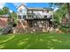 Multi-tiered backyard features a stone patio, screened in porch and a large grassy area at 1835 Berkeley Ne Mews, Atlanta, GA 30329
