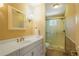 This bathroom has a single sink vanity and shower at 1835 Berkeley Ne Mews, Atlanta, GA 30329