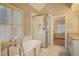 Bright bathroom featuring a standalone tub and glass-enclosed shower at 1835 Berkeley Ne Mews, Atlanta, GA 30329