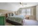 A bedroom featuring a sloped ceiling and a window with plantation shutters at 1835 Berkeley Ne Mews, Atlanta, GA 30329