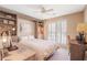 This bedroom features a bed, a desk, a ceiling fan, and some cabinets at 1835 Berkeley Ne Mews, Atlanta, GA 30329