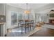 Sun-lit breakfast nook with a view of the fireplace, connecting to kitchen at 1835 Berkeley Ne Mews, Atlanta, GA 30329
