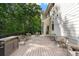Spacious outdoor deck, perfect for entertaining, features seating and a built-in grill area at 1835 Berkeley Ne Mews, Atlanta, GA 30329