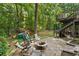 Backyard fire pit seating area and playhouse offers spaces for both adults and children at 1835 Berkeley Ne Mews, Atlanta, GA 30329