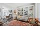 Well appointed home office with built-in bookshelves seamlessly connects to the adjacent living room at 1835 Berkeley Ne Mews, Atlanta, GA 30329