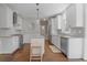 Modern kitchen with island, white cabinets, stainless steel appliances, and hardwood floors at 1835 Berkeley Ne Mews, Atlanta, GA 30329