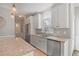 Bright kitchen with white cabinets, granite countertops, and stainless steel appliances at 1835 Berkeley Ne Mews, Atlanta, GA 30329