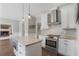 Modern kitchen featuring white cabinets, granite countertops, and stainless steel appliances at 1835 Berkeley Ne Mews, Atlanta, GA 30329