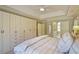 A primary bedroom featuring built-in cabinetry and an ensuite bathroom at 1835 Berkeley Ne Mews, Atlanta, GA 30329
