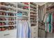 A fully-organized walk-in closet with shelves and hanging racks provides optimal storage at 1835 Berkeley Ne Mews, Atlanta, GA 30329