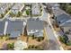 A high-angle view showcases the home and surrounding neighborhood with manicured lawns and mature trees at 340 Marietta Walk Ln, Marietta, GA 30064