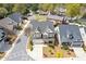 Aerial view of a charming two-story home with well-maintained landscaping and a three-car garage at 340 Marietta Walk Ln, Marietta, GA 30064