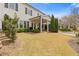 Large, grassy backyard with a covered patio perfect for entertaining and relaxing at 340 Marietta Walk Ln, Marietta, GA 30064