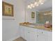 Bathroom vanity with decorative framed art pieces, granite countertops, and a large mirror at 340 Marietta Walk Ln, Marietta, GA 30064