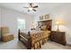 A bedroom featuring a dark wood bed, side tables with lamps, and neutral carpet at 340 Marietta Walk Ln, Marietta, GA 30064