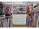 Organized walk-in closet with shelving, drawers, and hanging storage for clothes and accessories at 340 Marietta Walk Ln, Marietta, GA 30064