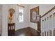 Elegant foyer with dark wood floors, a decorative art piece, and a view of the staircase at 340 Marietta Walk Ln, Marietta, GA 30064
