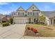 Charming two-story home with a well-manicured lawn and a two-car garage and appealing curb appeal at 340 Marietta Walk Ln, Marietta, GA 30064