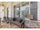 Inviting front porch seating area with stone accents and stylish decor near a large window at 340 Marietta Walk Ln, Marietta, GA 30064