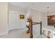 Upper hallway with decorative table, railing, and wall art at 340 Marietta Walk Ln, Marietta, GA 30064