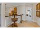 Upper hallway with decorative table, railing, and view into a bedroom at 340 Marietta Walk Ln, Marietta, GA 30064