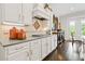 Well-equipped kitchen with stone countertops, a gas cooktop, and white cabinets at 340 Marietta Walk Ln, Marietta, GA 30064