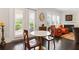 Cozy living room with hardwood floors, plantation shutters, and a stylish fireplace at 340 Marietta Walk Ln, Marietta, GA 30064