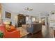 Open living room featuring hardwood floors, neutral walls, fireplace, and ceiling fan at 340 Marietta Walk Ln, Marietta, GA 30064