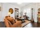 Cozy living room with hardwood floors, vintage decor, area rug, and natural light from the window at 340 Marietta Walk Ln, Marietta, GA 30064