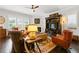 Inviting living room with dark hardwood floors, cozy seating arrangement, and a decorative fireplace at 340 Marietta Walk Ln, Marietta, GA 30064